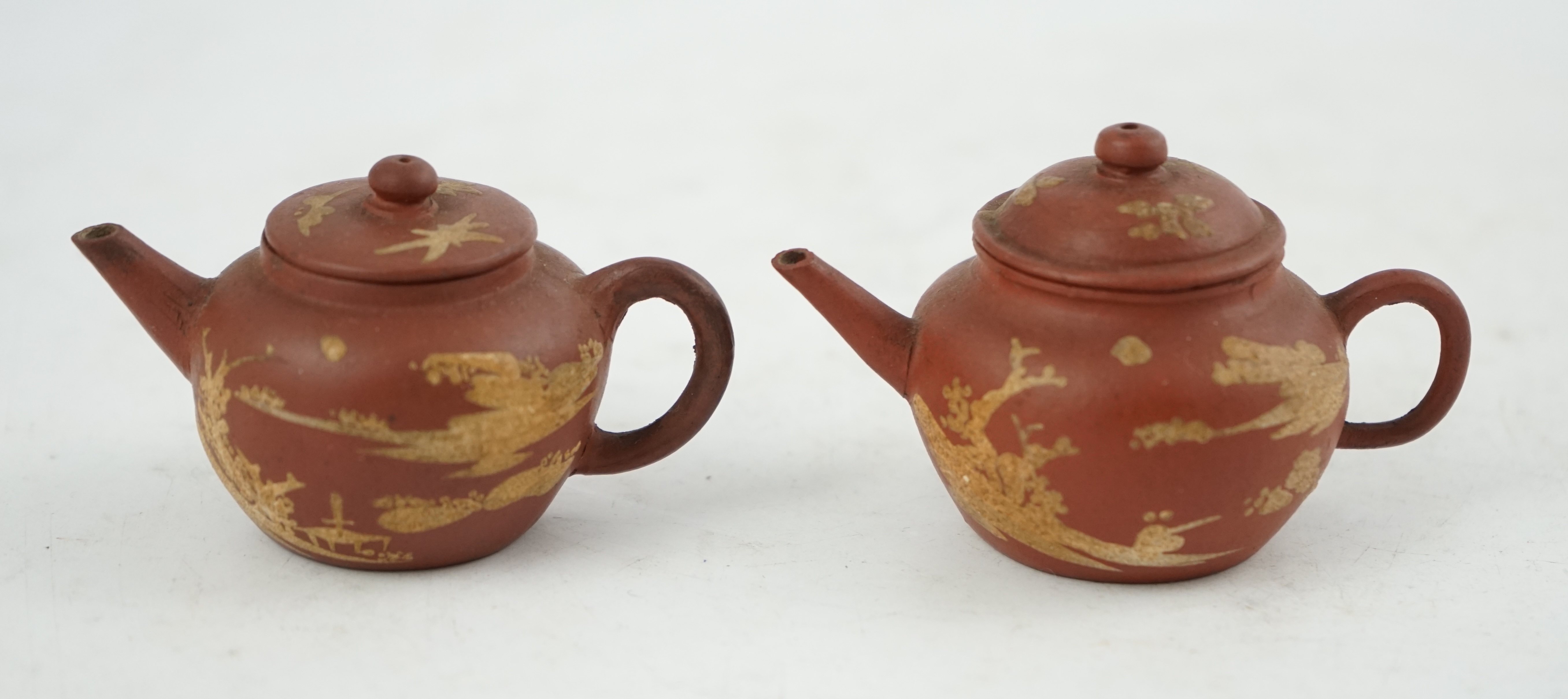 Two Chinese Yixing slip-decorated miniature teapots and covers, 18th/19th century